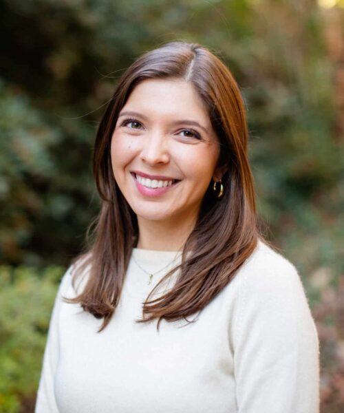 A Woman Smiling For The Camera
