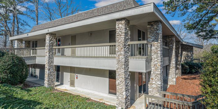 Exterior View Of A Multi-family Residential Building With Stone Accents, Highlighting Available Residential Properties