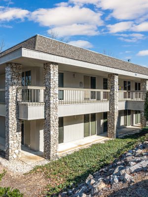 Exterior View Of A Multi-family Residential Building With Stone Accents, Highlighting Available Residential Properties