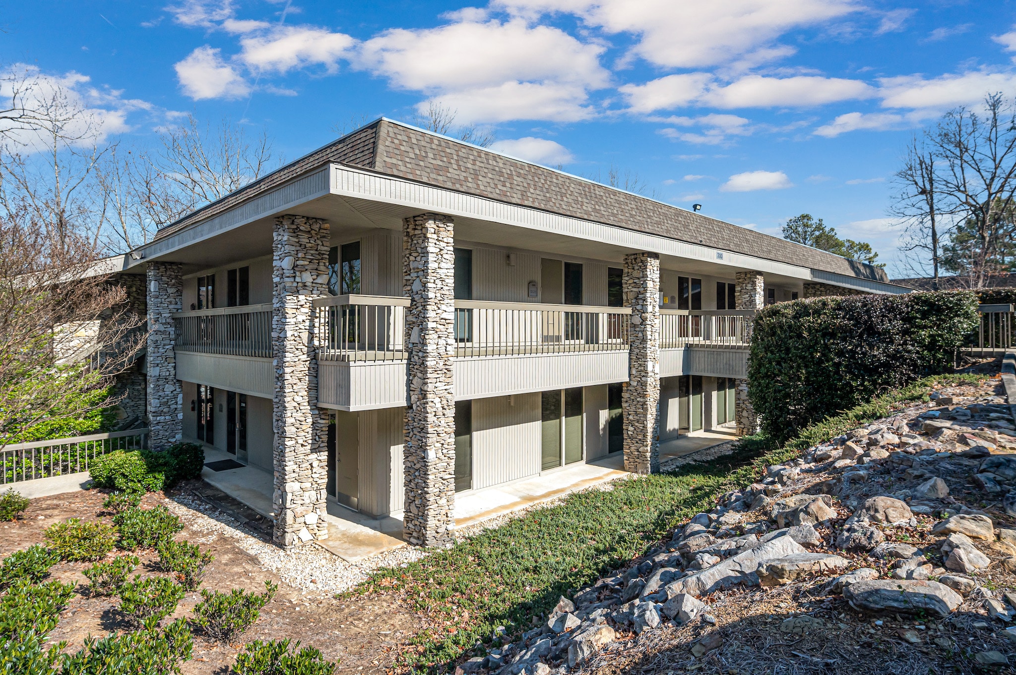 200-300-Vestavia Exterior view of a multi-family residential building with stone accents, highlighting available residential properties