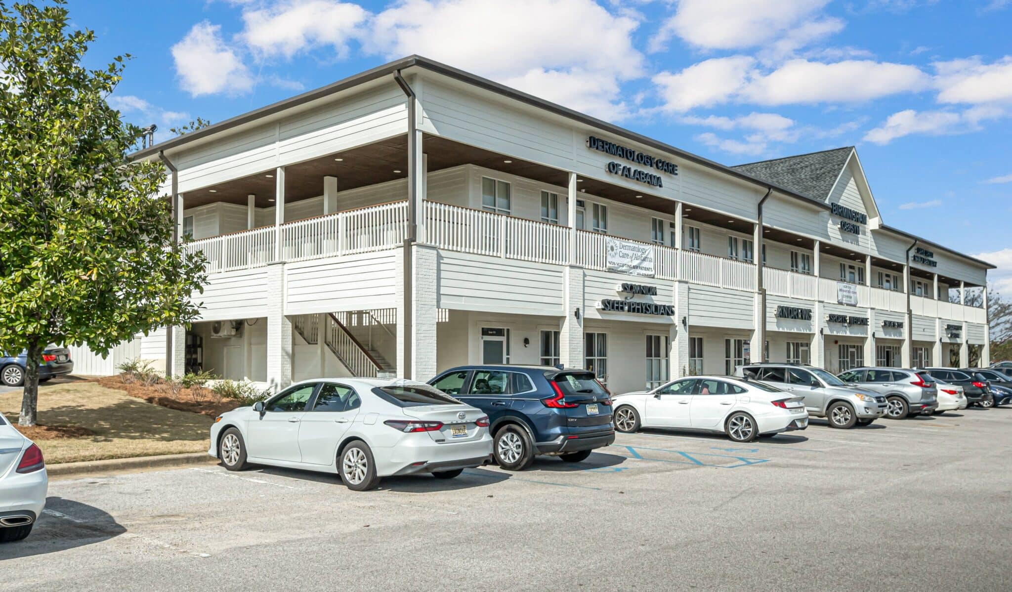 a car parked in a parking lot in front of a building