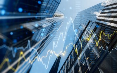 A View Of Downtown Birmingham Is Shown From Below, With An Investment Portfolio Graph Overlaid To Represent Growth After Relying On A Real Estate Investment Group.