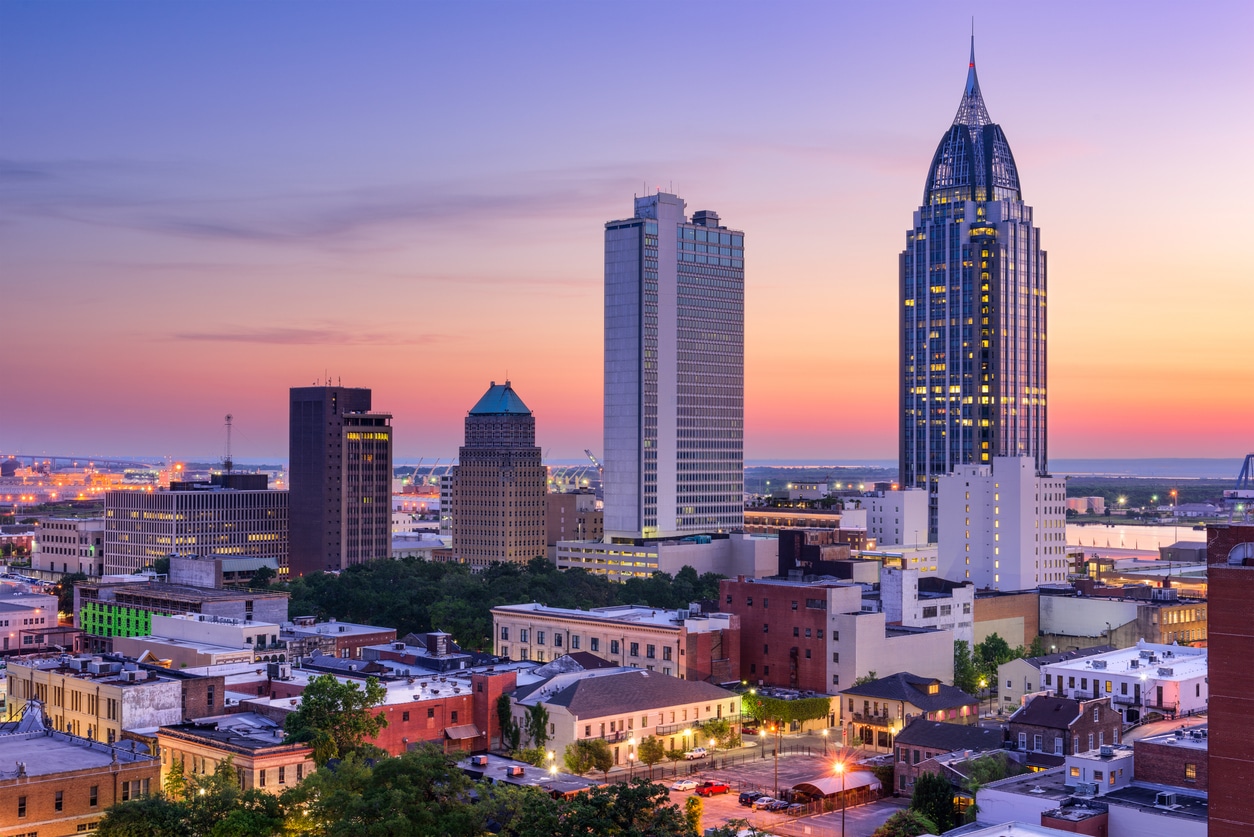 a large body of water with a city in the background